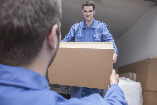 Professional flat removals in Shoreditch with moving team preparing boxes