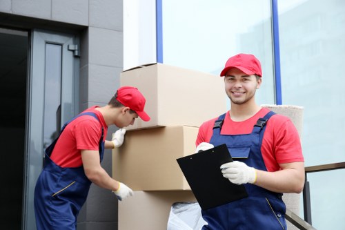 Removal team handling furniture in Shoreditch flat